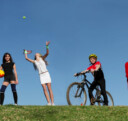 Youth athletes from multiple sports on a hill