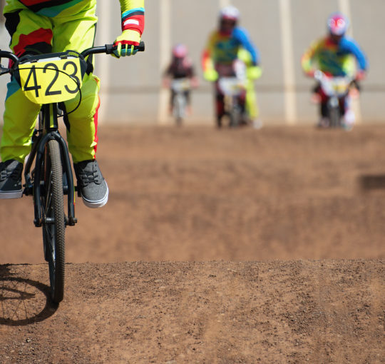 Multiple cyclists on a dirt course