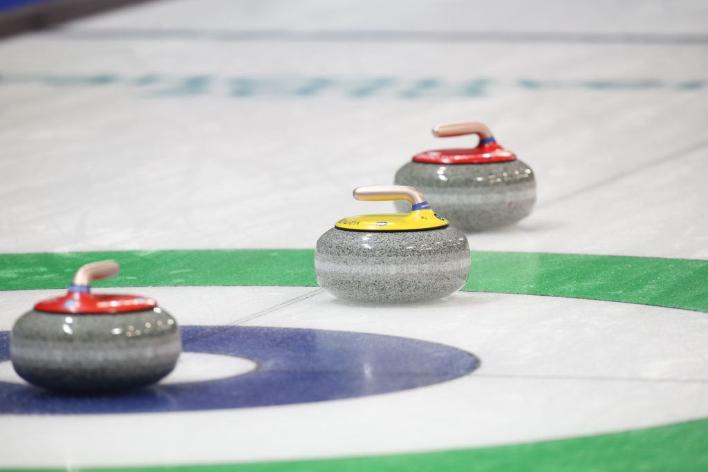 Three curling stones