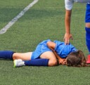 A female youth soccer player injured on the field