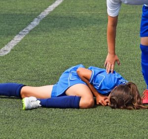 A female youth soccer player injured on the field