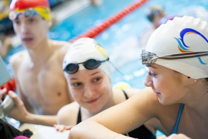 Swimmers talking to each other after practice