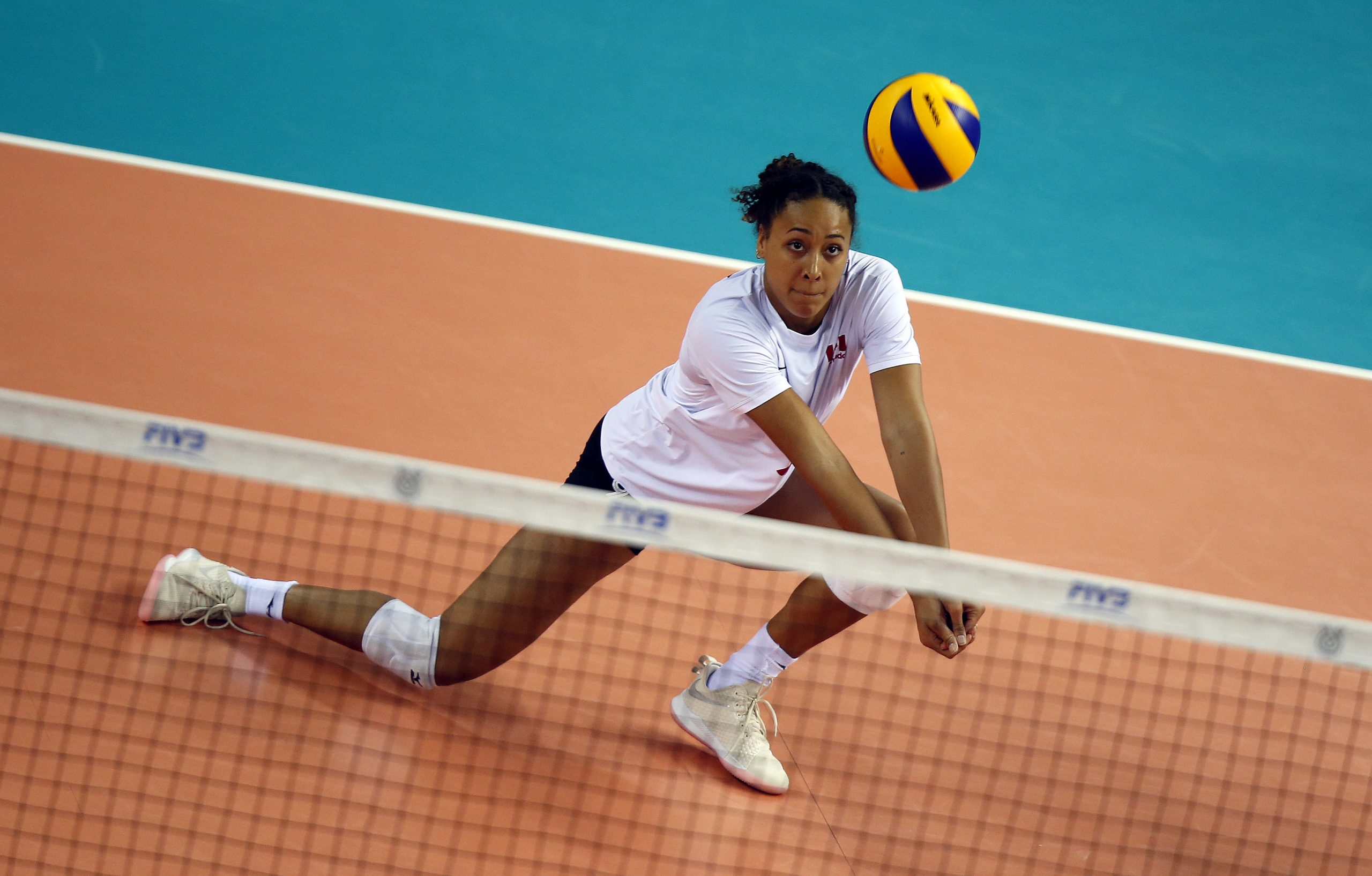 Female volleyball athlete in competition