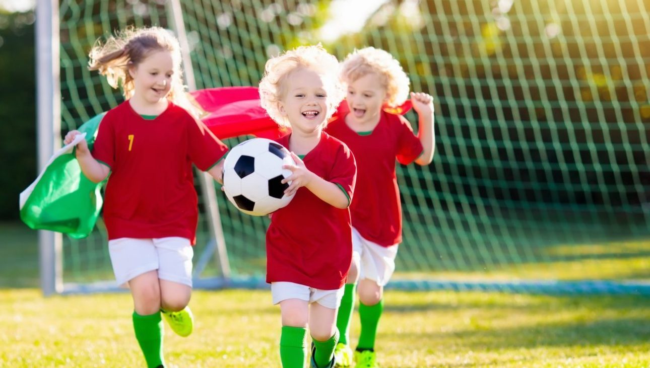 toddlers playing soccer