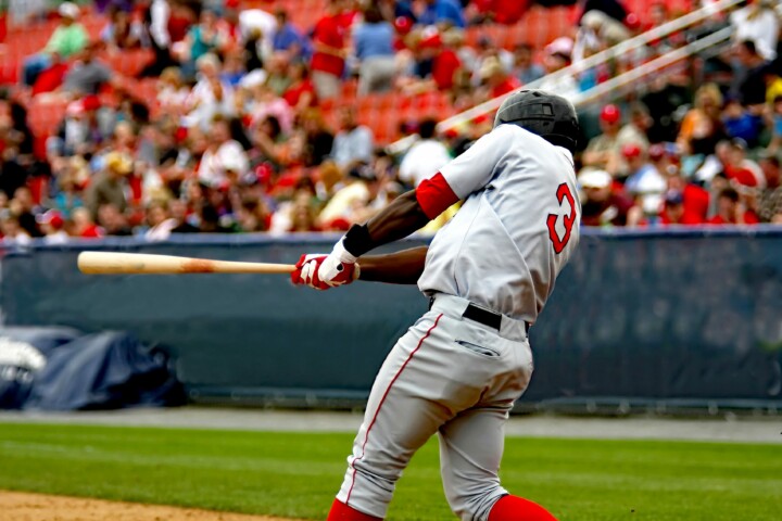 baseball player swinging bat