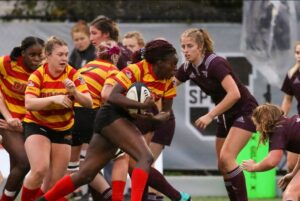 Female athletes playing rugby