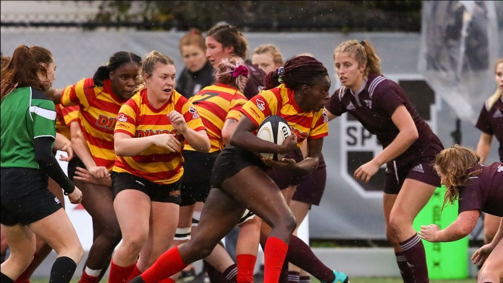 Female athletes playing rugby