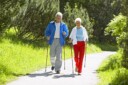 Senior couple walking on path.