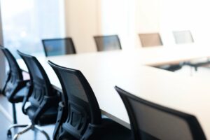 Empty chairs in a board room setting