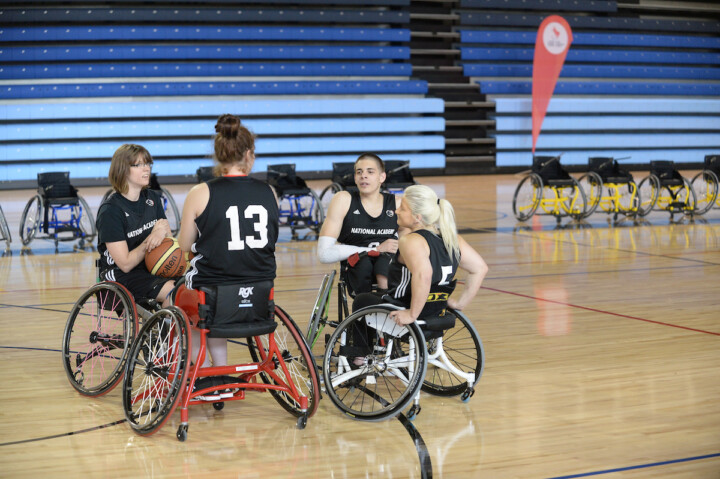Womens wheelchair basketball players having a conversation