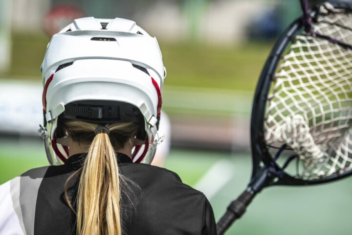 girl wearing a lacrosse helmet