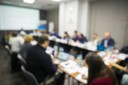 Blurred image of a boardroom meeting.