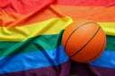 Basketball ball against lgbt rainbow flag