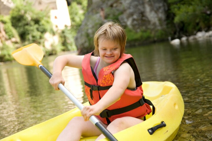 Young girl with Down syndrome in a canoe