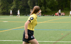 Soccer referee running with play
