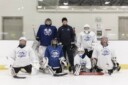 Photo d'une équipe de hockey masculine de jeunes et de ses entraîneurs