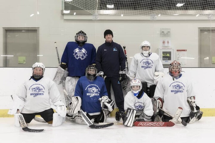 Picture of a male youth hockey team and their coaches