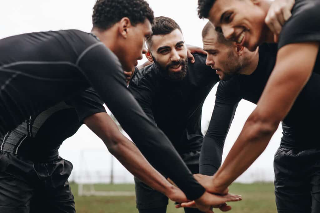 Athletes talking together during a timeout