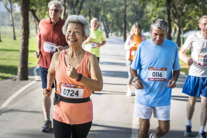 Group of older adults running a marathon