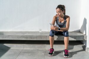 female runner resting after a run