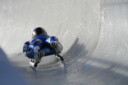 Luge athlete coming down the course during competition