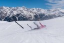 Skier falling going down the mountain
