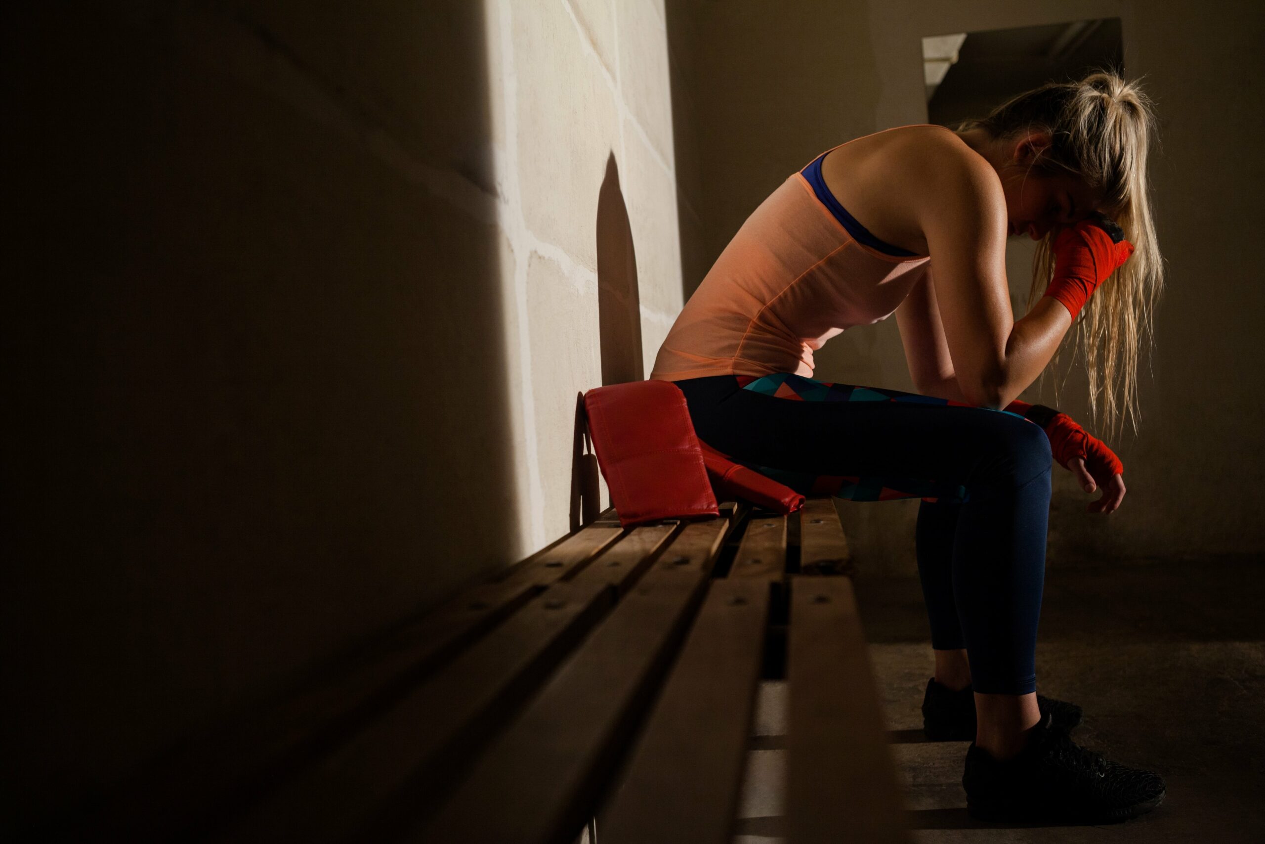a woman in a locker room deal with mental health.