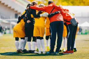 Team huddle with coach