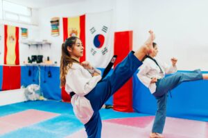 Girls performing martial arts in a karate studio