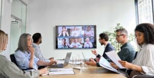 A group of office workers in a board meeting