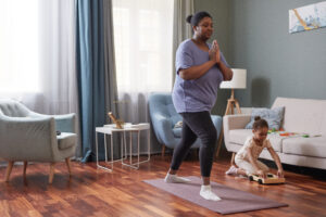 Young Mother doing Yoga at Home