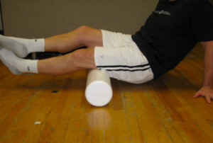 Athlete rolling out their hamstrings