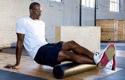 Athlete foam rolling their calf muscle