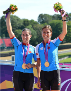 Robbi Weldon and guide at medal ceremony for Paralympics