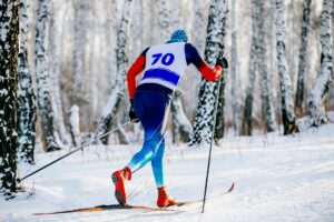 A cross country skiier on a nature trail.