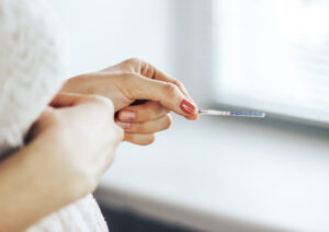 person holding ovulation stick