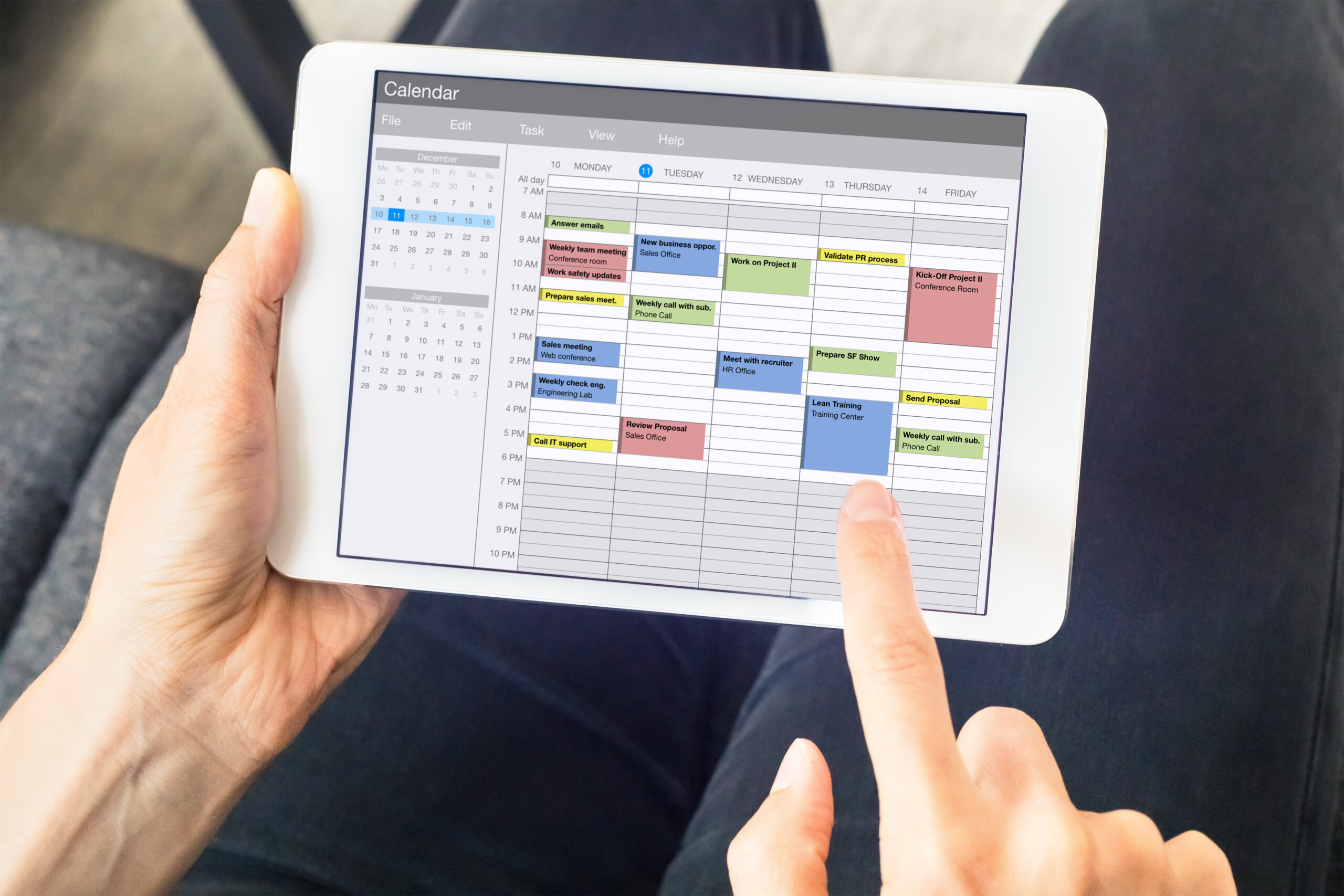Calendar app on tablet computer with planning of the week with a